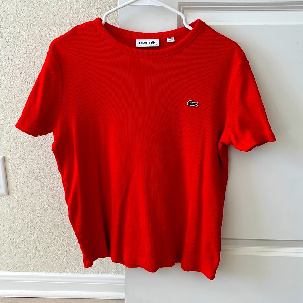 This is a red, short sleeve tee from Lacoste.